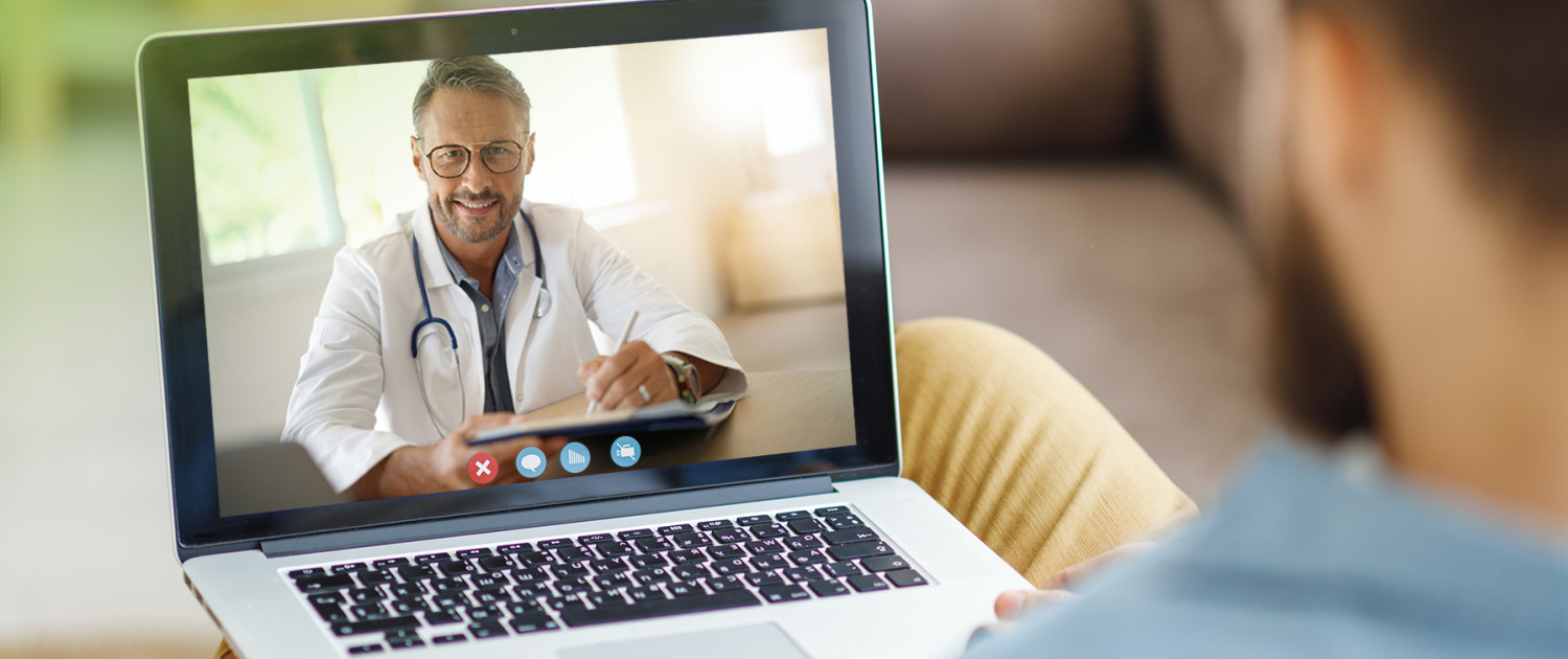 Stethoscope and laptop on doctor working desk with blurred focus for background, business and health care concept